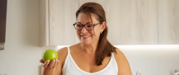 Person holding apple